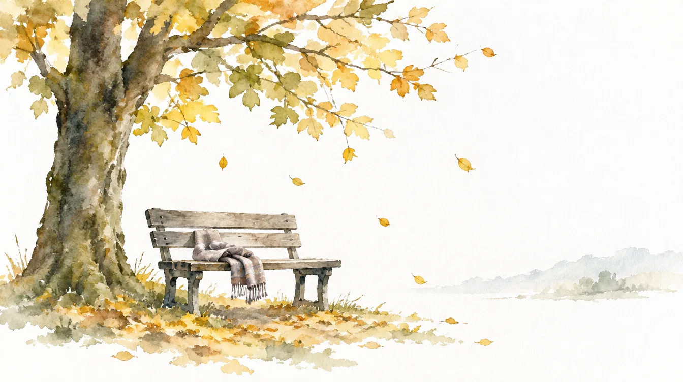 Aquarell: eine Bank unter einem Herbstbaum, darauf ein Schal